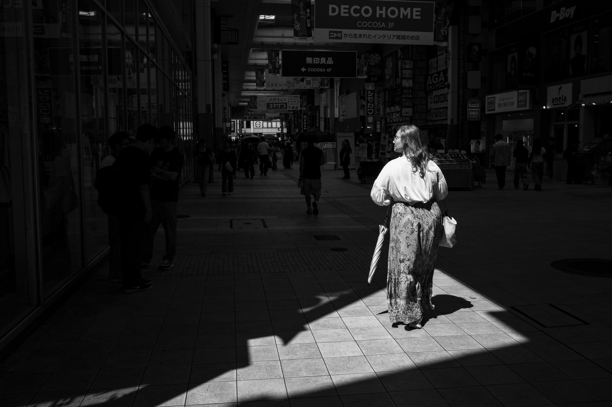 The light draws a room with no walls, just for her.